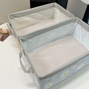 A Set of Two Foldable Storage Boxes