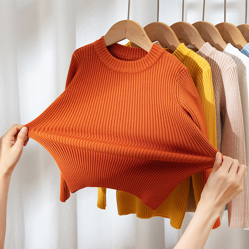 Suéteres infantiles 2025, nuevo estilo de otoño e invierno, ropa interior de punto para niños y niñas, suéter de cuello redondo versátil de color liso.