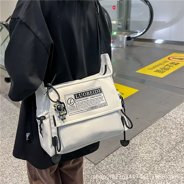 Messenger Bag Men's fashion brand tooling large capacity shoulder bag men's backpack College student messenger bag female class commuter bag