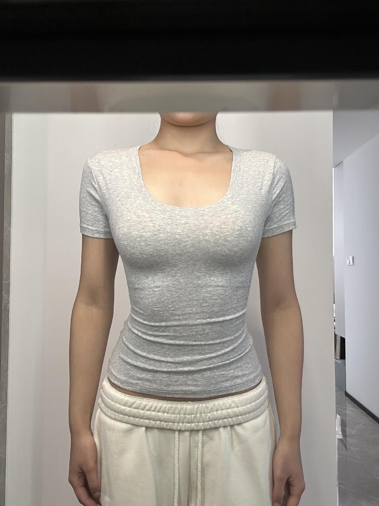 現物スキムズ肌に優しいモチモチU襟の肩の半袖のギャルのフィットネスのtシャツは丸首の砂時計を修理して腰の上着を収めます。