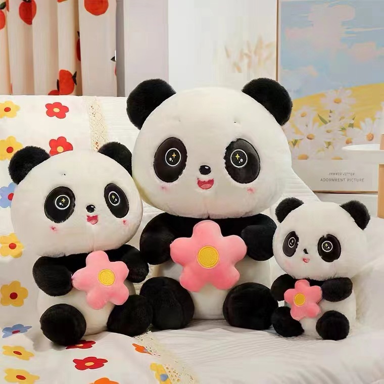 Panda con flores en brazos