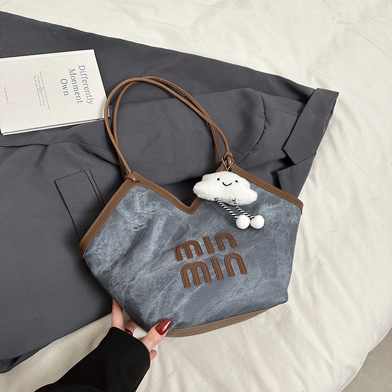 2024 nueva bolsa de gran capacidad para mujeres, bolso de hombro Sen Meng, bolso de diseño de nicho, bolso de viaje de alta calidad para mujeres