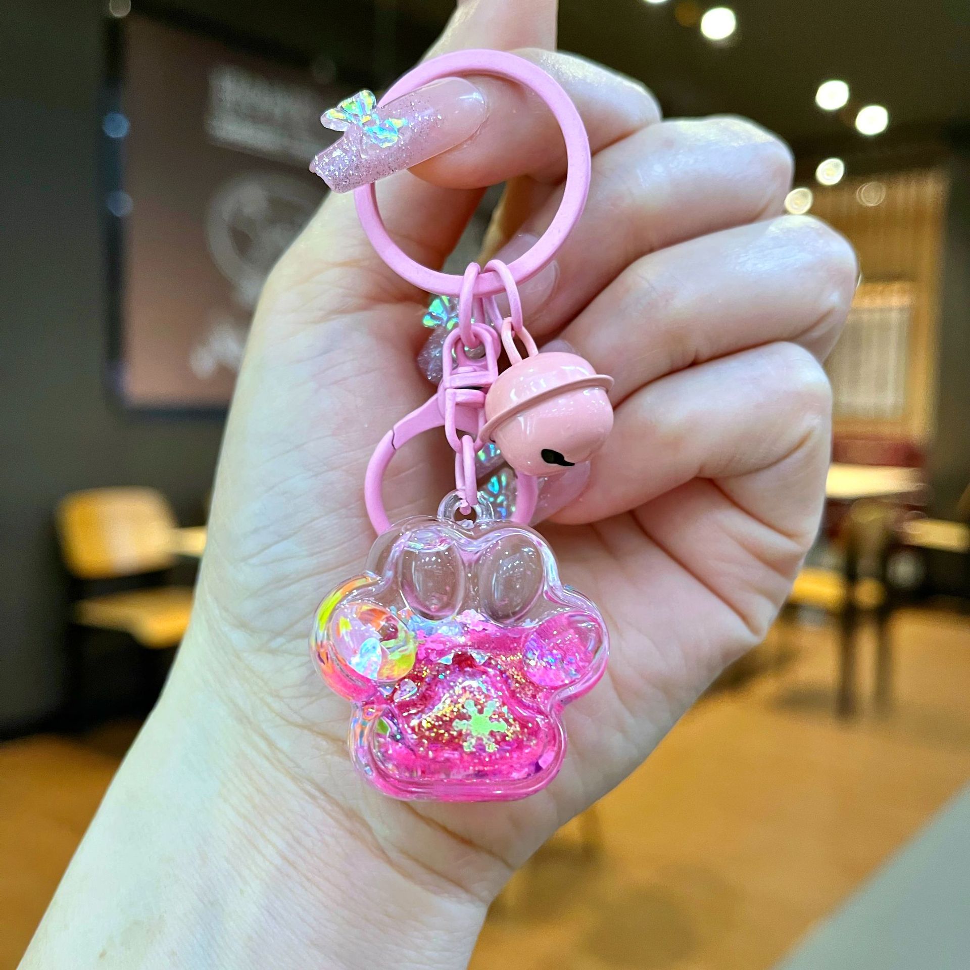 Aceite de gato garra arenas movedizas llavero lindo dibujos animados cadena colgante captura muñeca máquina agarrar pequeño regalo al por mayor