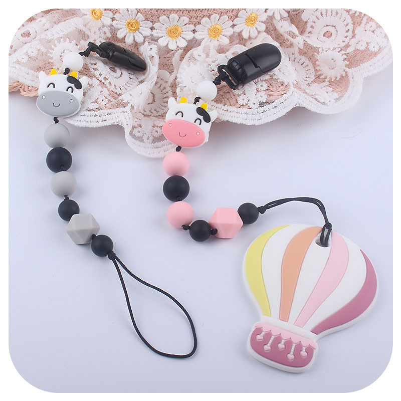 Suministros para bebés de silicona vaca chupete cadena bebé mordedor palo cadena anti-caída Amazon nueva cadena anti-perdida