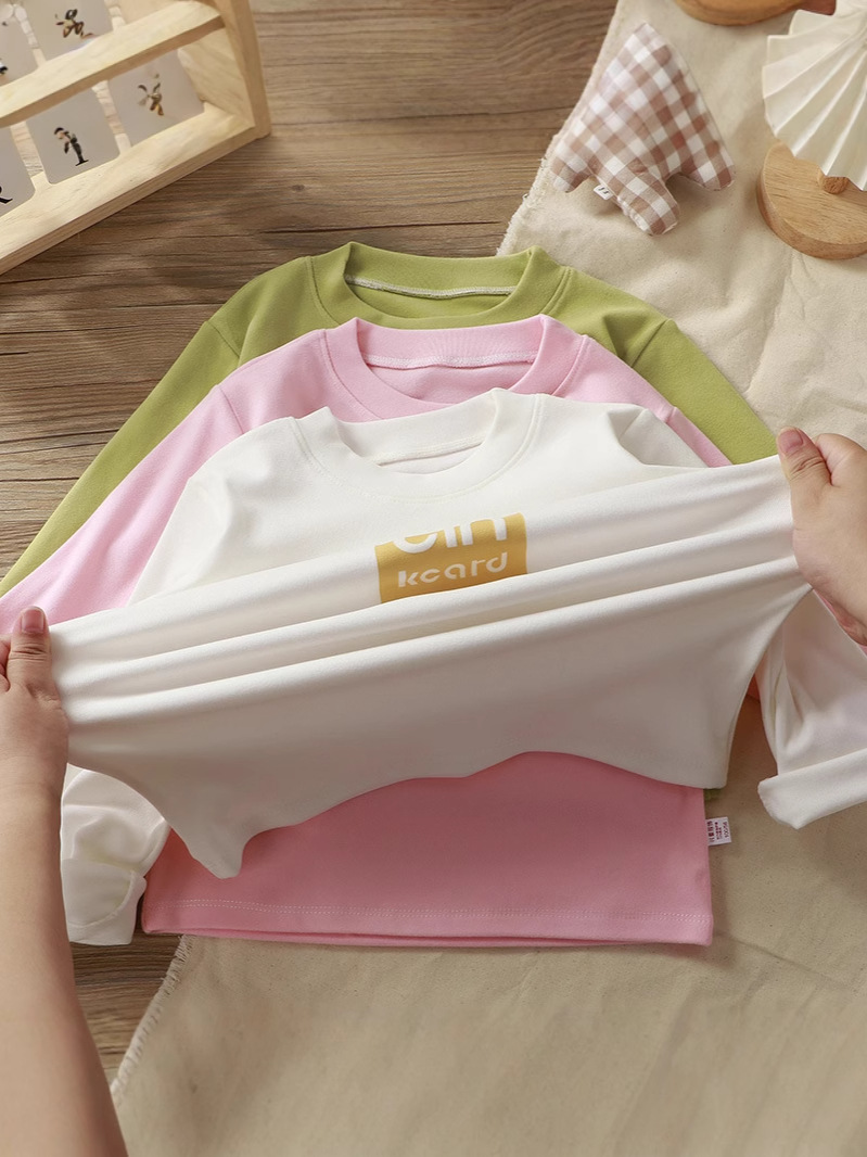 Camiseta de nuevo estilo para niños, camiseta térmica holgada de manga larga con cuello redondo, top elástico para niñas y niños, camiseta interior para niños.