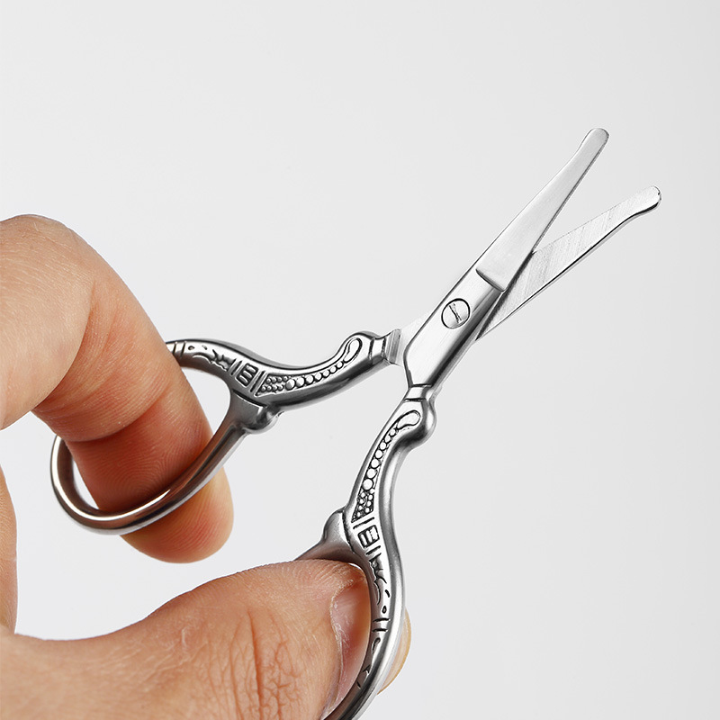 Tijeras Xiaofeng de acero inoxidable Tijeras bordadas Tijeras en relieve Bolsitas de té Tijeras de hilo de pescado Tijeras de maquillaje para cejas