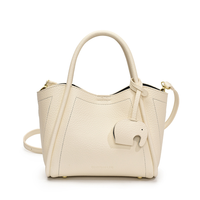 Tendencia transfronteriza de moda canasta de platos de mano 2025 nuevo nicho de alta sensación bolso de hombro bolso de cubo universal para mujeres