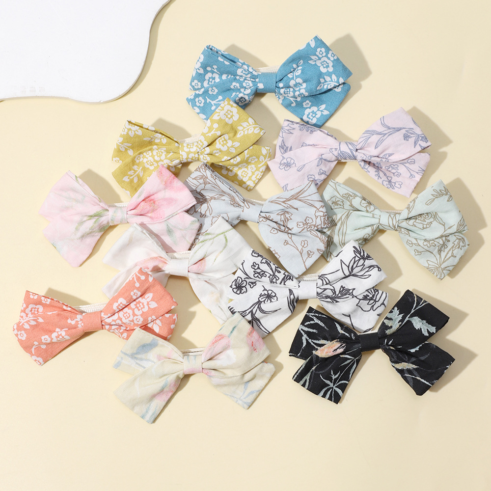 Fermagli per capelli con fiocco per bambine clip stampate_voghion.com