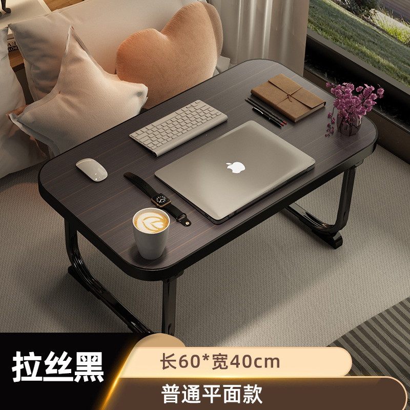 ベッドの上の机は折りたたみます。|undefined