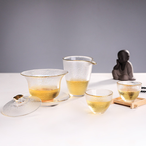 Transparent glass textured plum blossom three-tiered lid bowl with gold rim, hammered pattern gongdao cup and small teacup wholesale