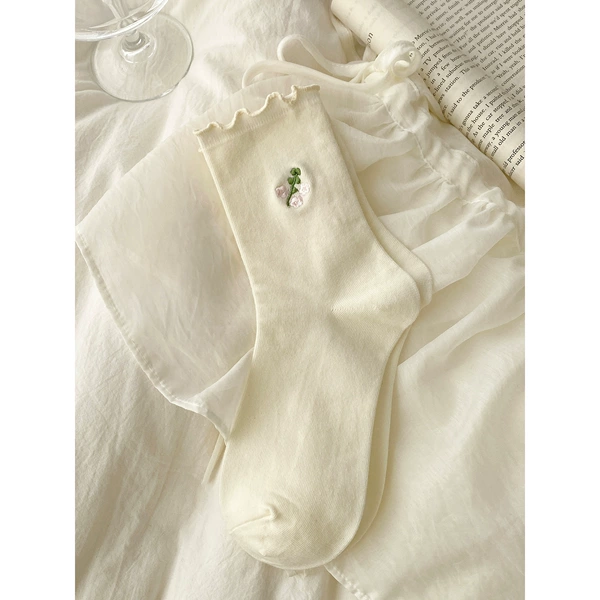 Flower-shaped, white, with embroidery