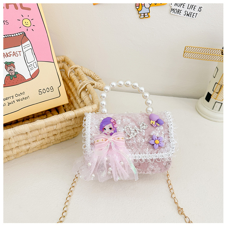 Primavera y verano nuevos bolsos infantiles, bolsos de perlas de arco, bolsos de mano, princesa de estilo extranjero, bolsos de cambio de hombro