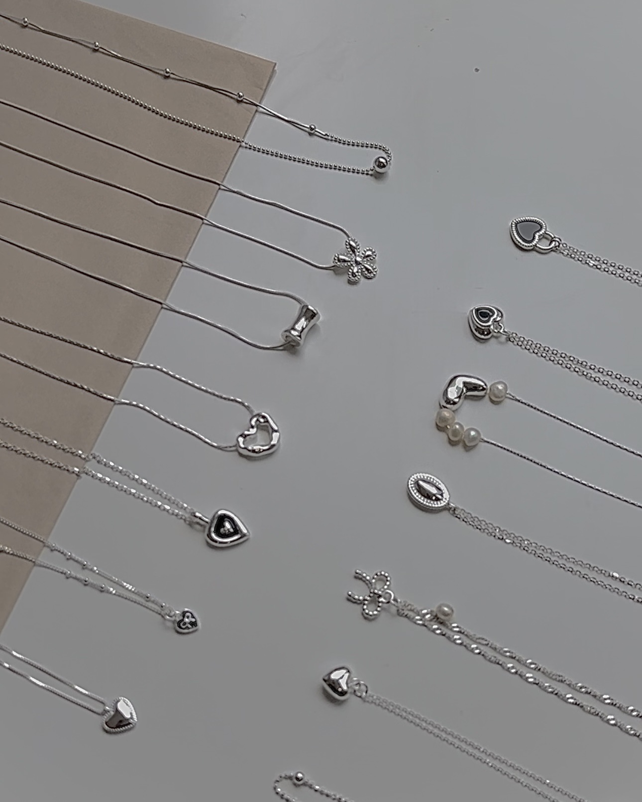Collana con ciondolo a cuore e fiocco in argento, catena a strati_voghion.com
