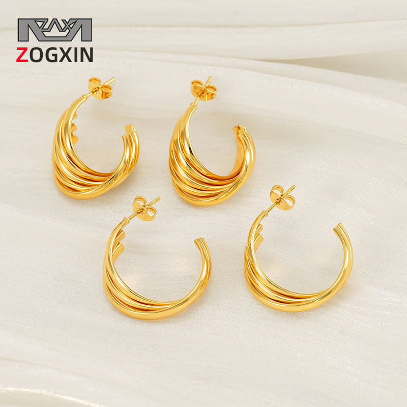 Pendientes de giro geométrico retro al contado de nuevo estilo Pendientes de anillo de acero de titanio de temperamento dorado de 18 quilates de moda