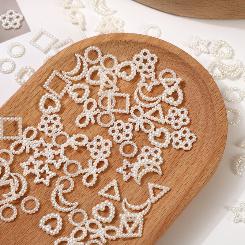 Hollow pearl handmade explosions white moon bow love five-pointed star three-dimensional nail decoration accessories wholesale