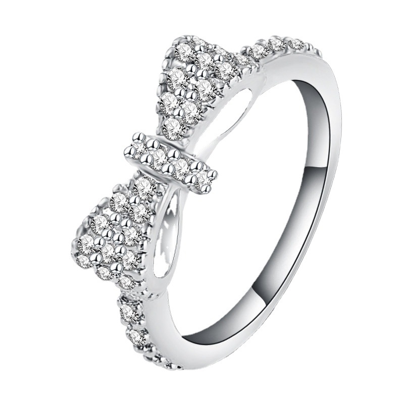 fashionable ring with stone with bow with zircon