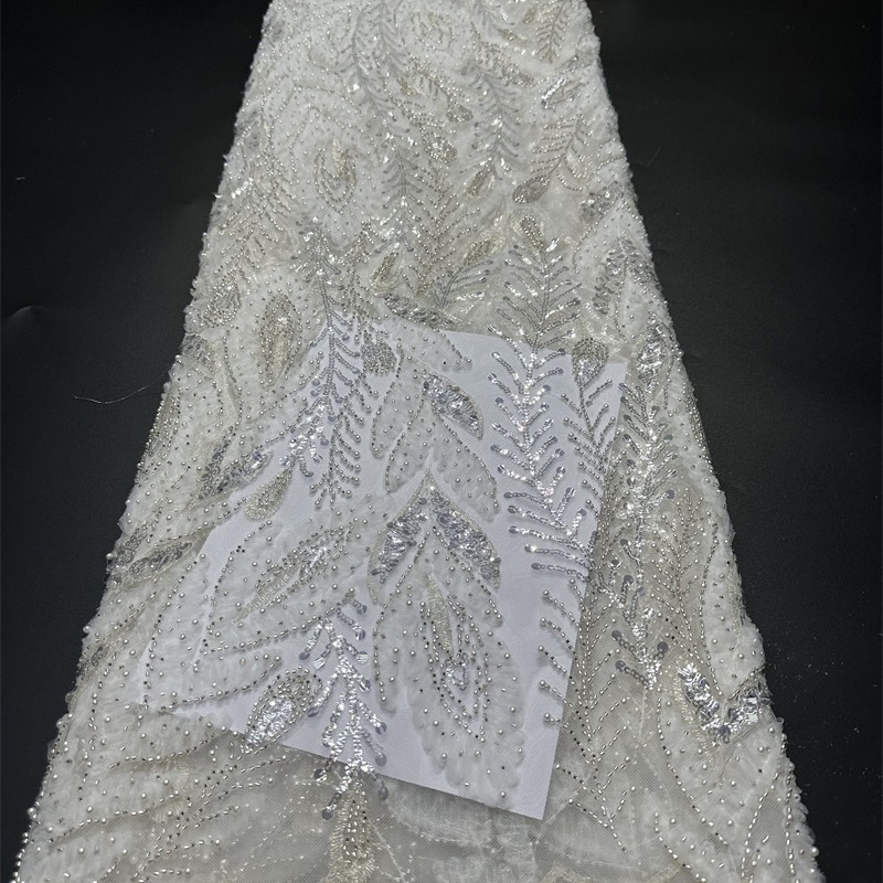 Tejido de tubo de perlas huecas tela bordada de tela de moda vestido de boda tela de encaje transfronterizo