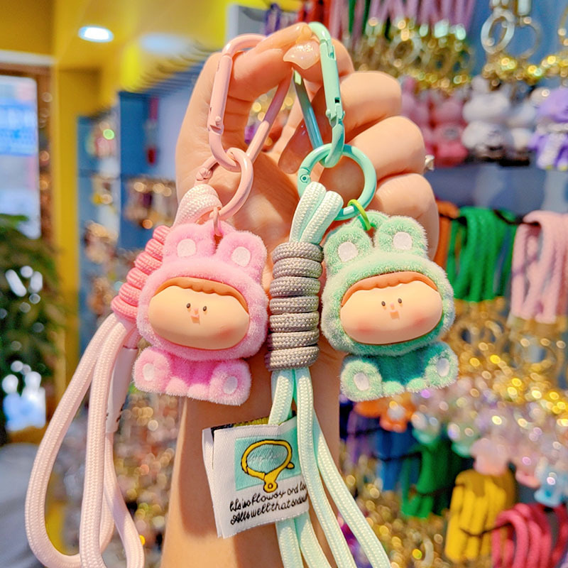 Caricatura floc amarelis llavero de automóvil pareja colgante bolsos creativos colgar garra máquina regalos al por mayor