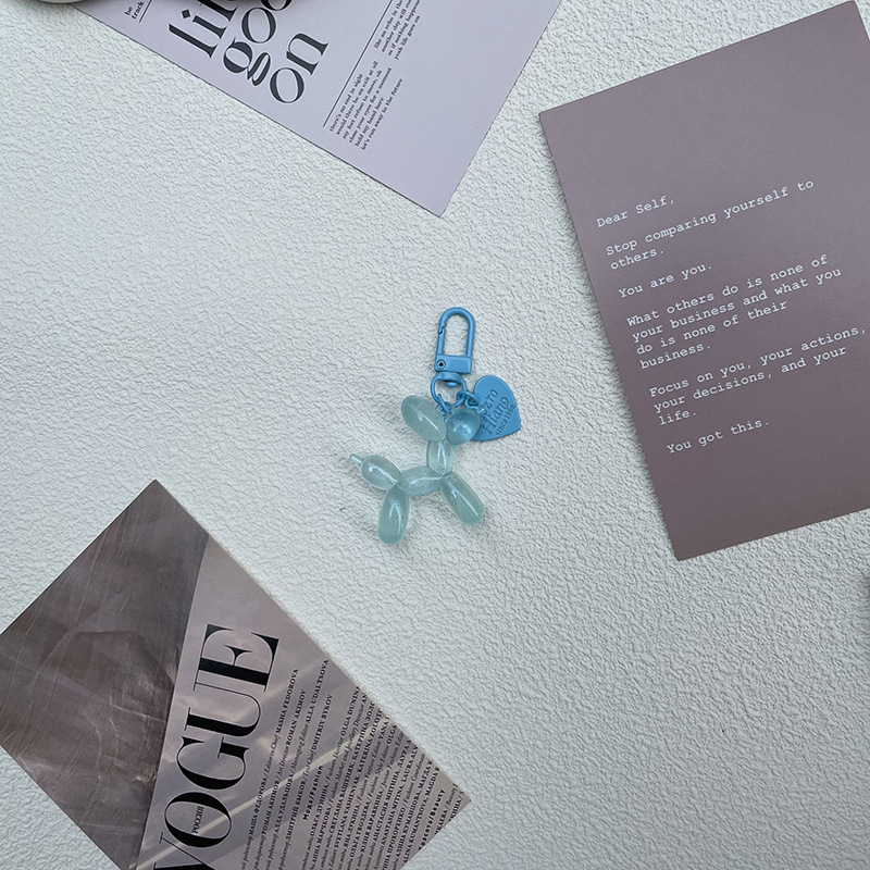 Pequeño Libro Rojo mismo lindo jalea globo láser perro llavero colgante colorido cachorro de dibujos animados teléfono llavero