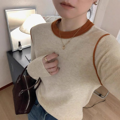 高級感のあるカラーの丸首のニットの底のシャツの女性の秋冬の頭の柔らかいモチとしているのはやせている長袖のセーターの女性の上着に似合います。