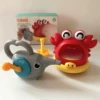 Crab spits bubbles + hand-cranked elephant (color box)