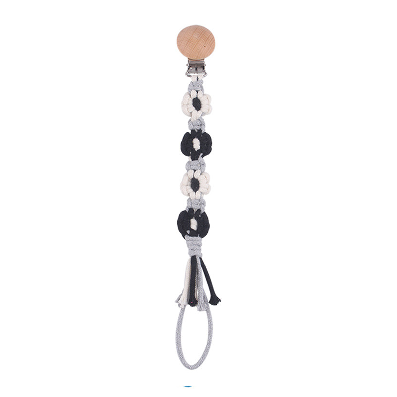 Productos para bebés Clip de chupete de haya de dibujos animados DIY creativo cuatro flores cadena de chupete de cuerda de algodón tejido a mano