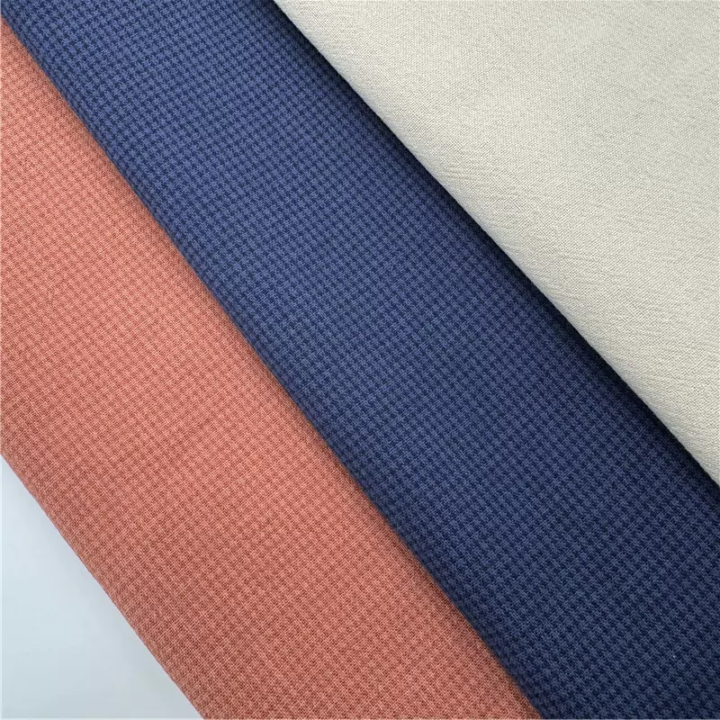 高级感树皮纹梭织面料 肌理感亲肤透气提花布料 潮牌中性风上衣料