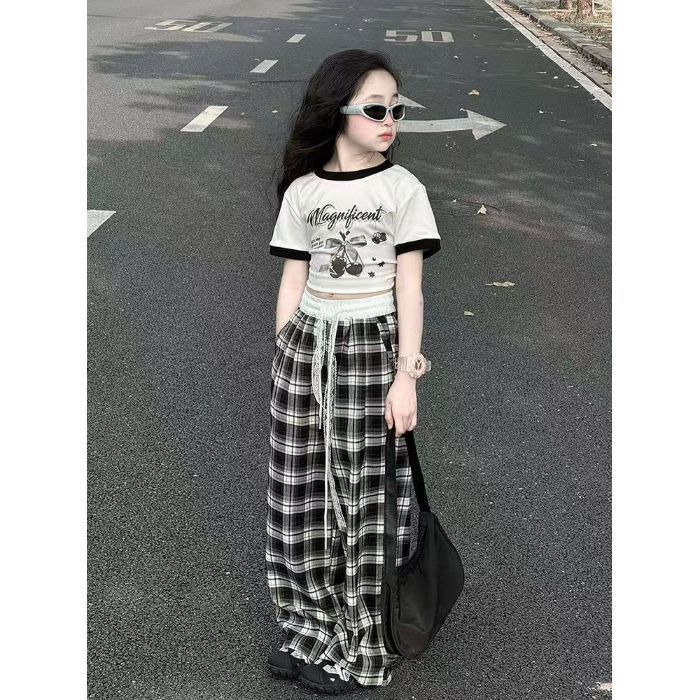Traje de niña 2025 nuevos niños verano estilo occidental moda dibujos animados manga corta casual niños grandes pantalones de pierna ancha dos piezas