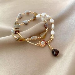 二重真珠は天然石のようにブレスレットを重ねています。