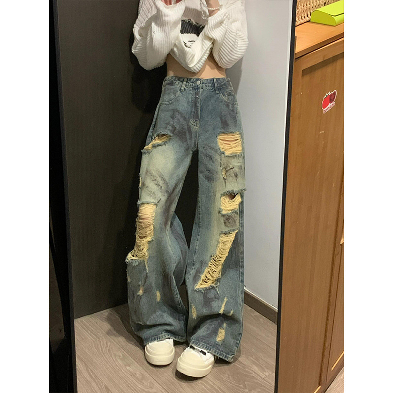 ファッションのファッションブランドの廃土の風は墨をかけて穴のジーパンの女性の秋の新型をつぶします。|undefined