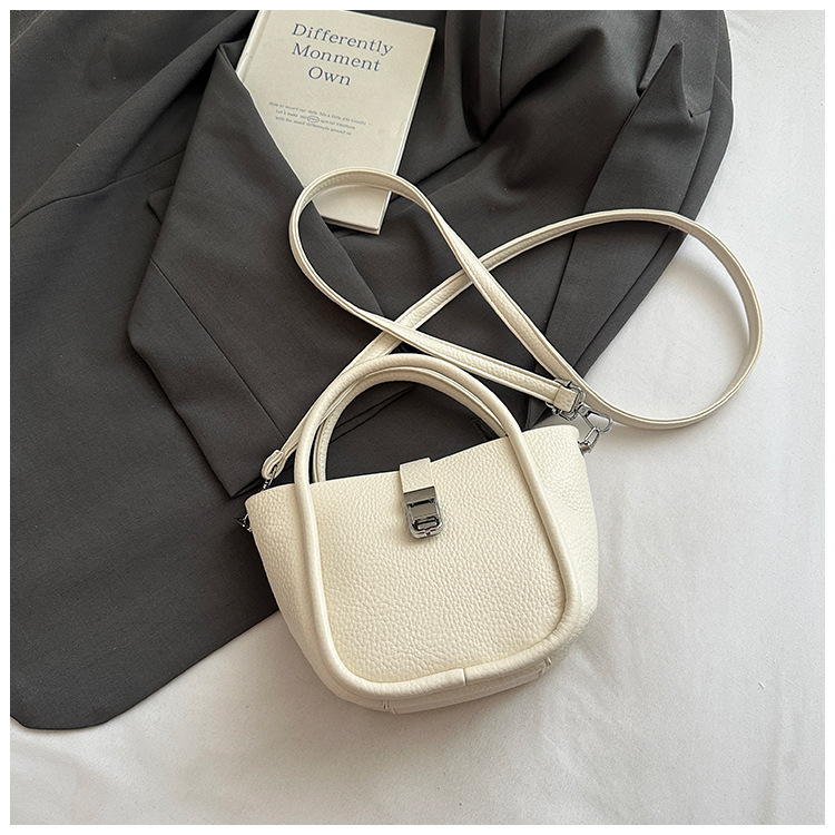 Bolso de cubo para mujer, tendencia transfronteriza de alta gama, bolso de mano con patrón de lichi, viaje diario, bolsa de mensajero de canasta de verduras de estilo occidental