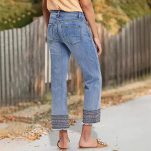 新塘牛仔裤新款跨境外贸女装高腰直筒民族风刺绣毛边九分牛仔裤