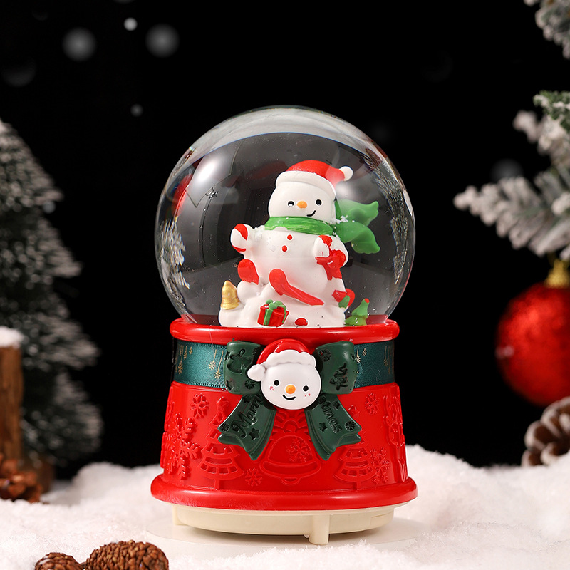 Una variedad de regalos de decoración de Navidad Navidad iluminante bola de cristal caja de música ventana diseño de velas lámparas de viento árbol de Navidad
