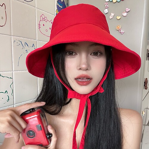 Red versatile Korean style strappy fisherman hat for women, lightweight, breathable, large brim, travel-showing face, small sunshade hat