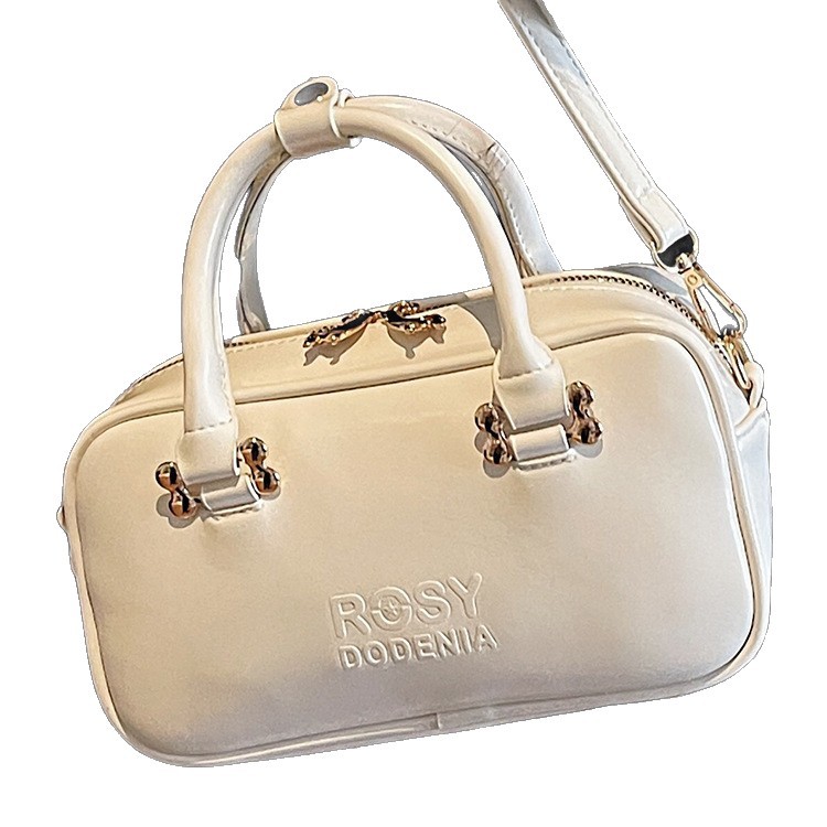 Bolsas de mano de moda populares para mujeres 2026 primavera nuevo estilo coreano sensación diaria bolsas de hombro para trabajar bolsas de viaje