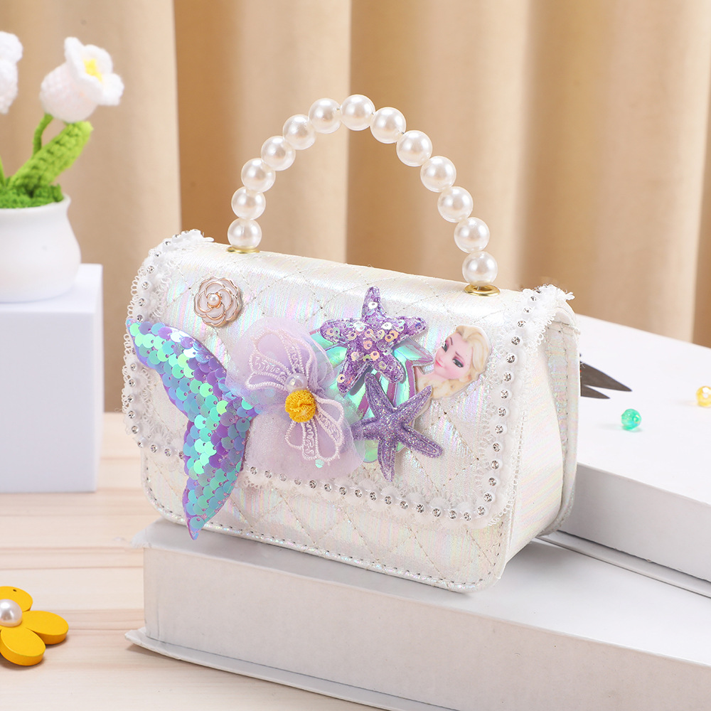 Monedero infantil con lazo, mochila pequeña, bolso bandolera de dibujos animados My Melody para niña, lentejuelas que reducen el peso