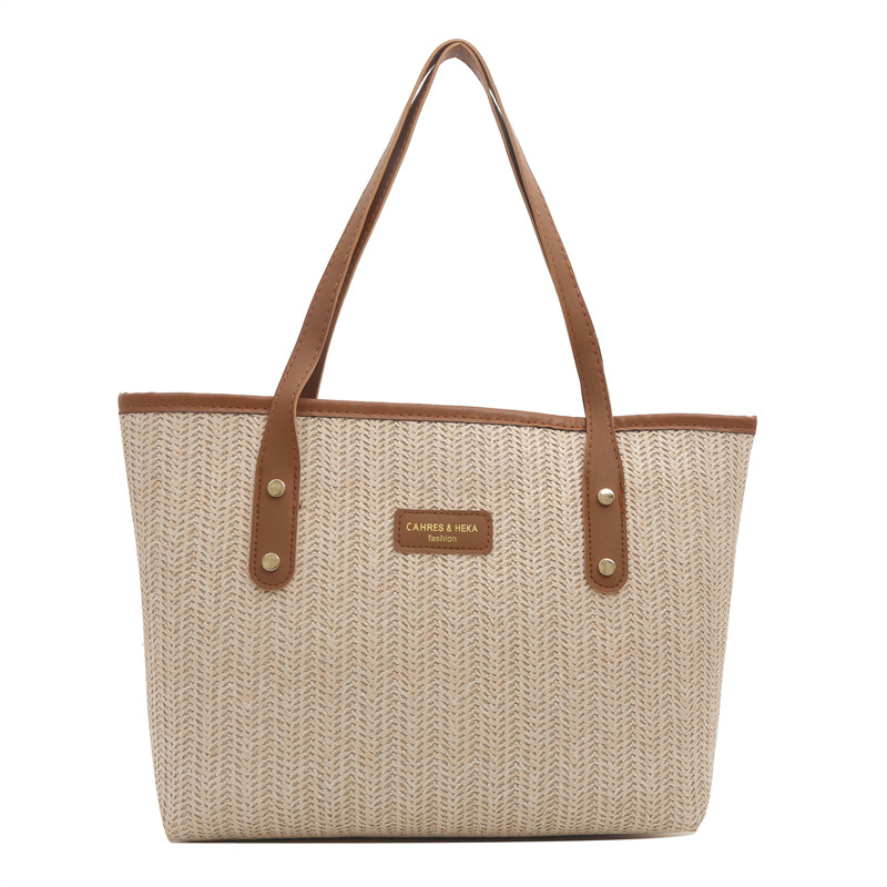 Bolso de paja de gran capacidad para viajeros para mujer 2024 nuevo estilo de moda y estilo occidental, bolso de axilas de color de contraste, bolso de Tote popular de este año