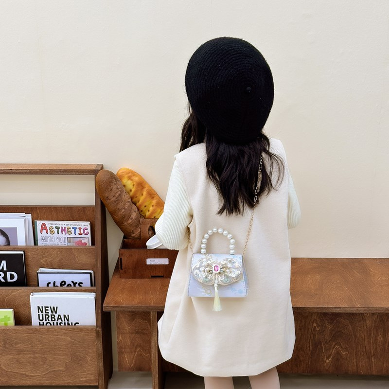 Bolso bandolera para niñas de estilo chino nuevo bolso bandolera para niños con borla portátil de perlas 2024 nuevo bolso de cadena para niños