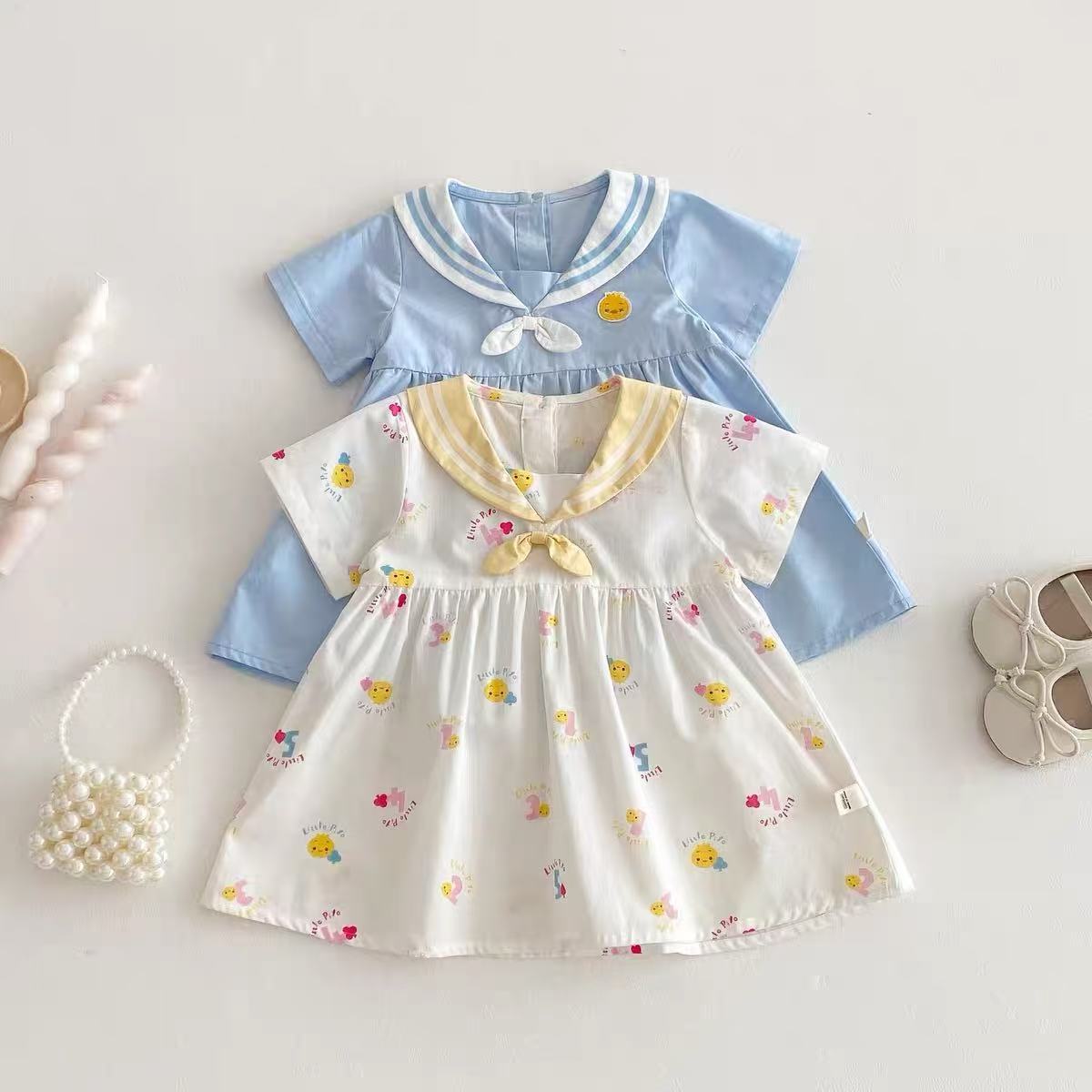 Vestido súper lindo para niñas nuevo verano bebé lindo vestido de manga corta de dibujos animados de verano azul marino