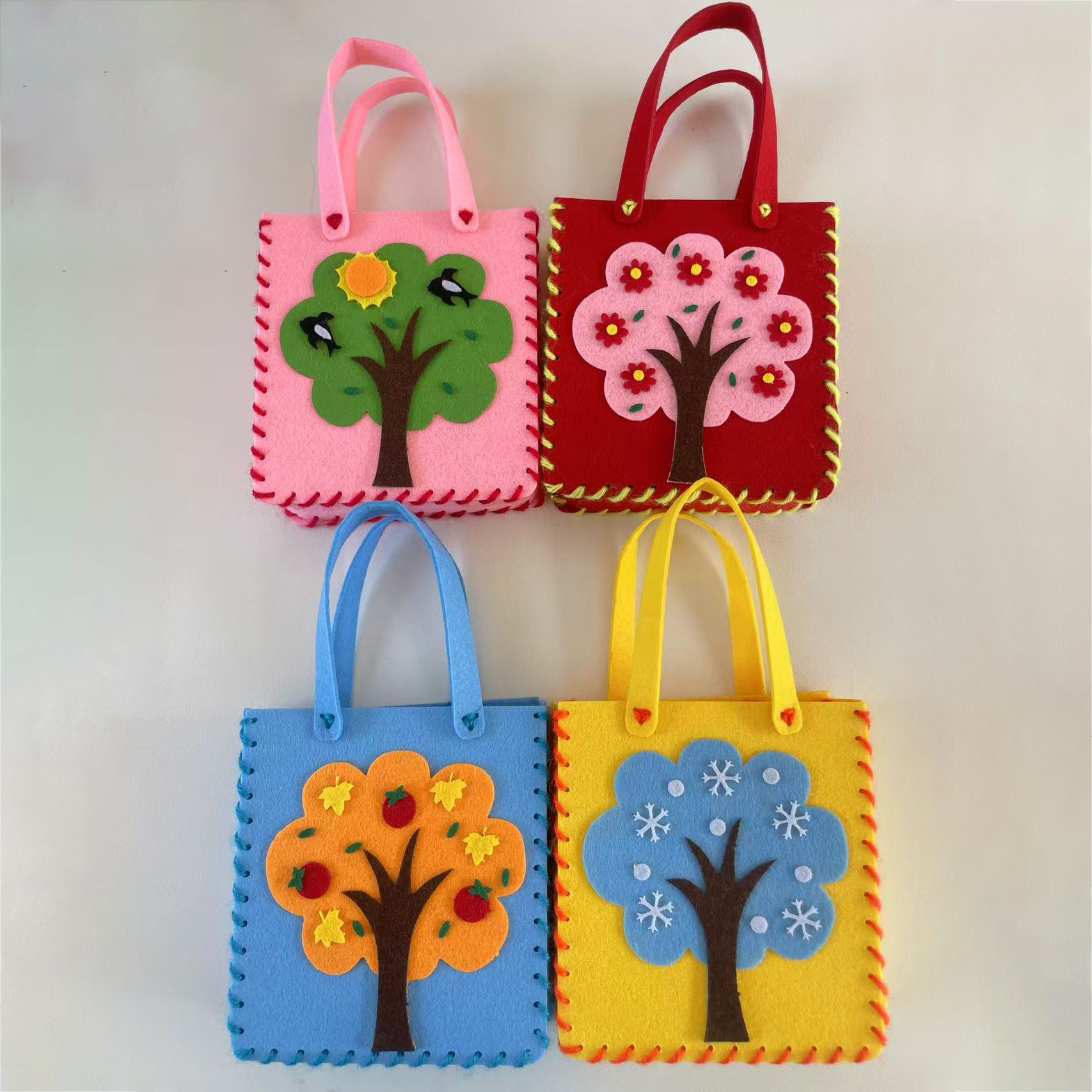 Jardín de infantes bolsas hechas a mano DIY bolsas de tela no tejida material de hacer juguetes creativos para niñas al por mayor