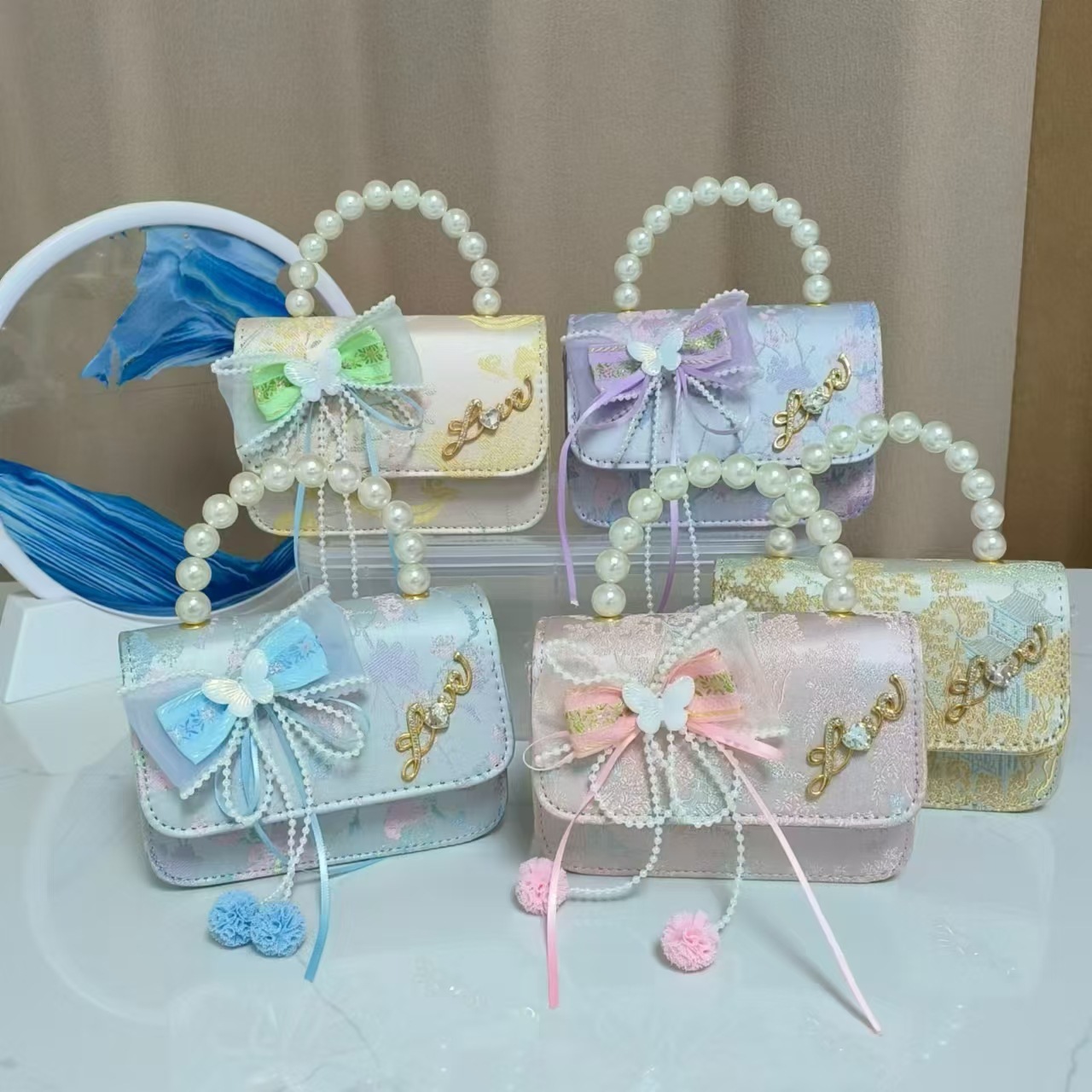 Bolsos infantiles de alto nivel antiguo bolso de cambio de niña pequeña princesa de perlas accesorios de ropa Han bolso de almacenamiento