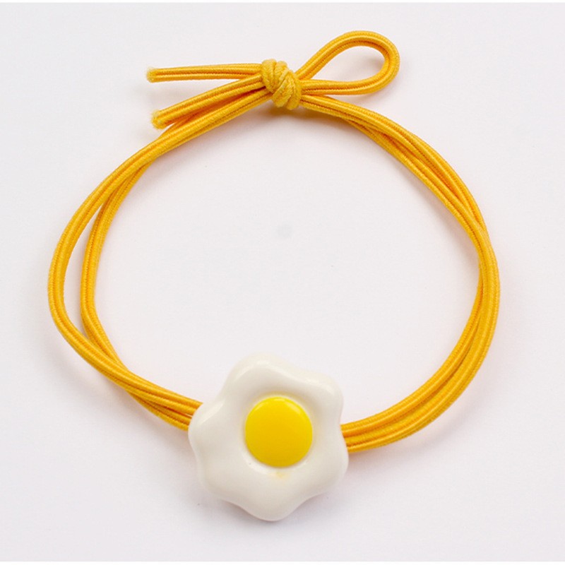 Yellow poached egg hair rope
