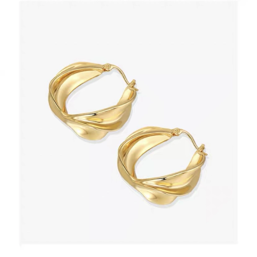 Golden metal small design earrings, trend of season