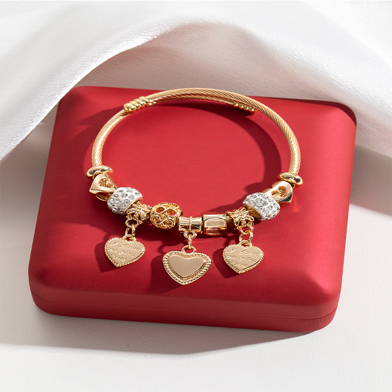 Panjia pulsera Dora DIY cuentas transfronterizas explosión de aleación en forma de corazón tallado colgante de letras de acero inoxidable brazalete de bola de perforación