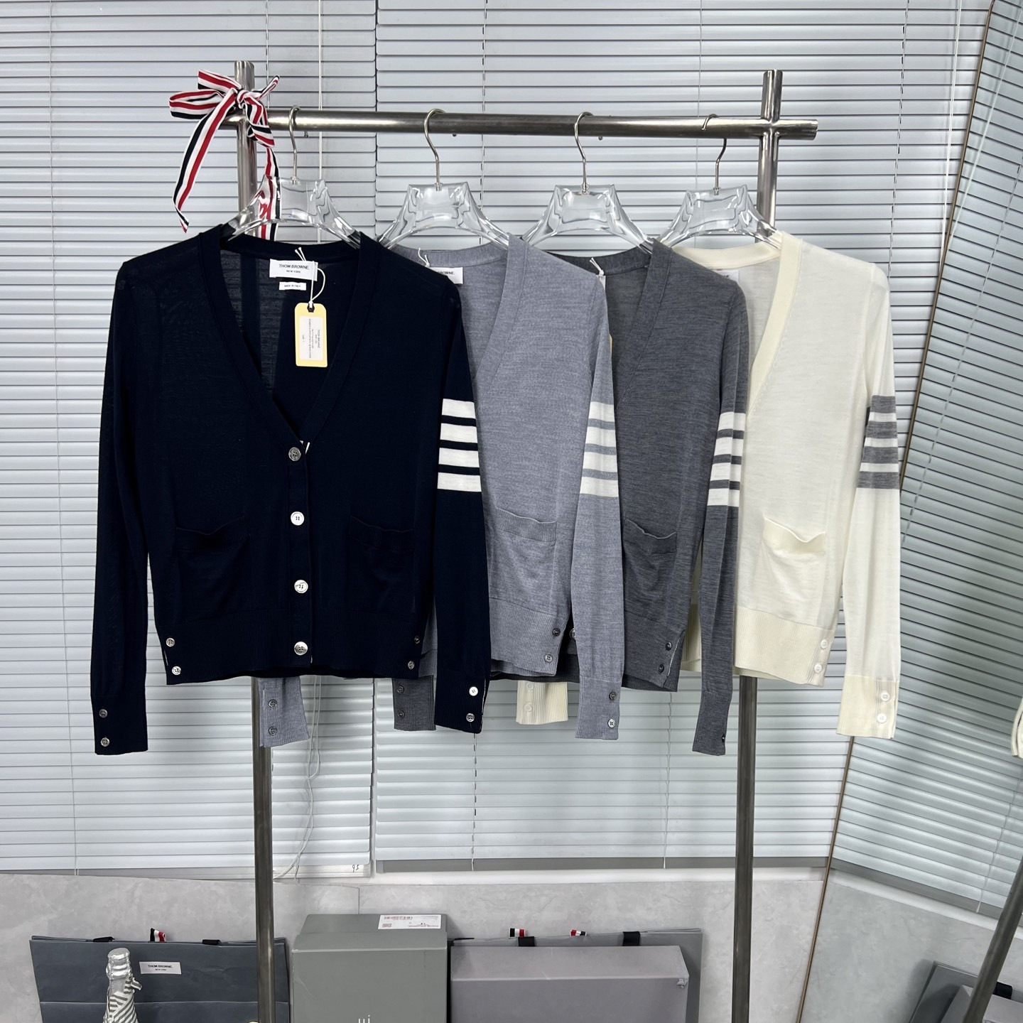 High-quality summer knitted four-stripe striped long-sleeved cardigan for women in Nanyou, Shenzhen; breathable and stylish.