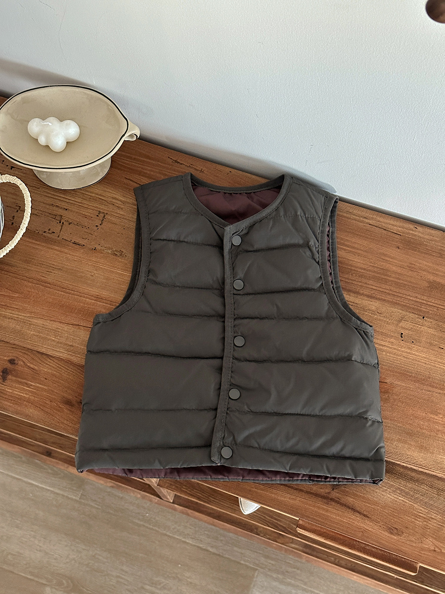 Otoño y invierno estilo coreano chaleco de pluma para niños ropa de niños ligera y delgada hombro caliente un chaleco de letras de moda