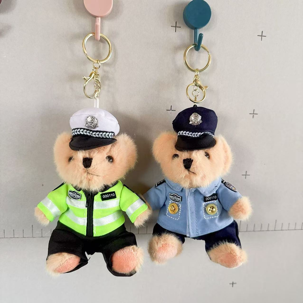 Políticas de tráfico en línea juguetes de peluche muñecas de agua de oso colgante bolso colgante llavero 4 pulgadas muñecas agarrar