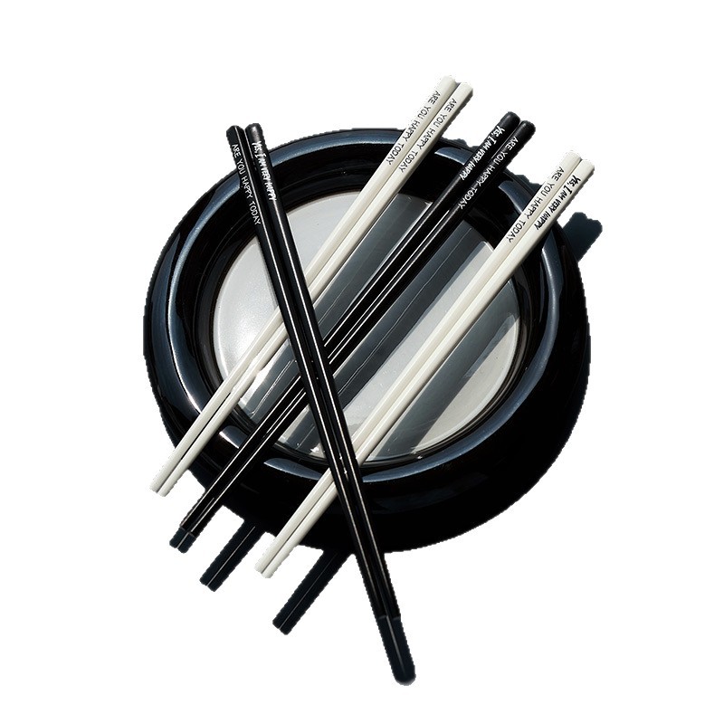 Palillos de estilo francés Hepburn ins moda color blanco y negro palillos de cerámica de alto valor conjunto de regalo para el hogar al por mayor