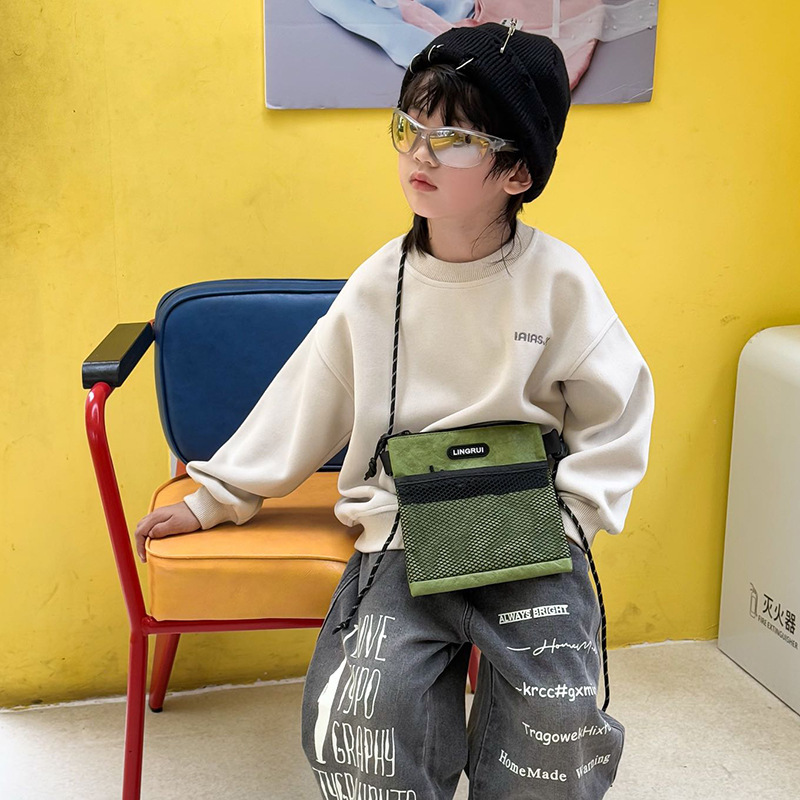 Bolso para niños coreano 2025 nueva moda moda cool bebé mochila accesorios para niños fuera mochila