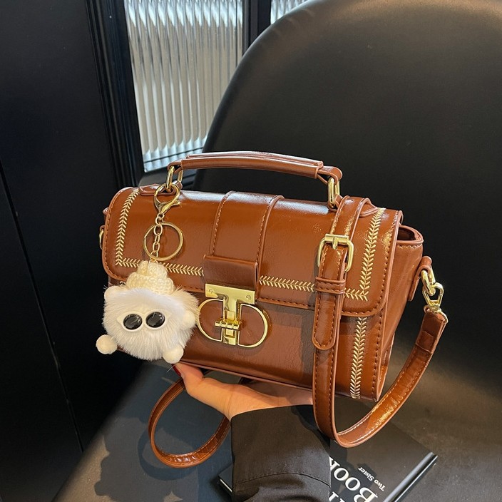 Bolsos de textura superior para mujeres 2025, nueva moda versátil bolso de mochila primavera y verano popular bolso de mano